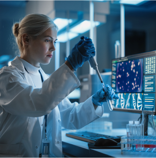 Scientist in laboratory examining test tube